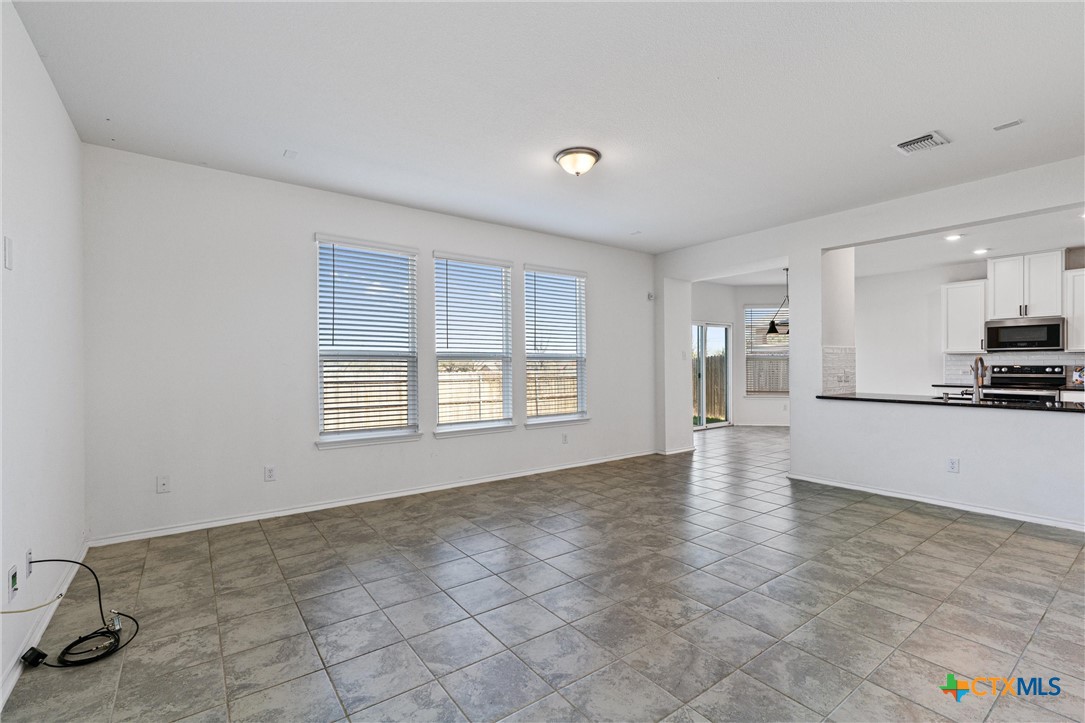 204 Benmyrtle Trail Georgetown, TX 78626 - Photo 7 of 35 a view of an empty room with a window
