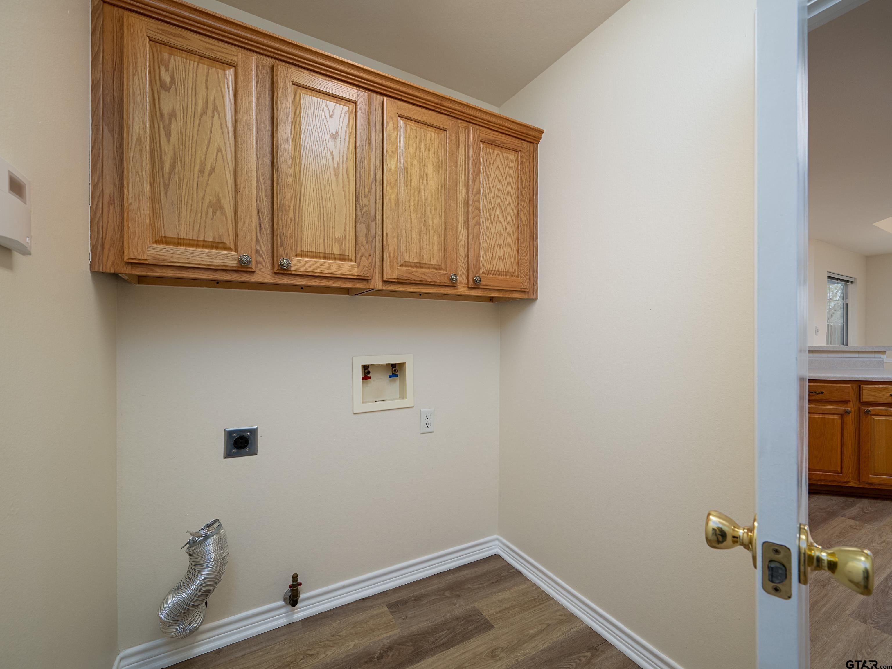 1521 Rice Road Tyler, TX 75703 - Photo 11 of 27 a view of storage and utility room with wooden floor