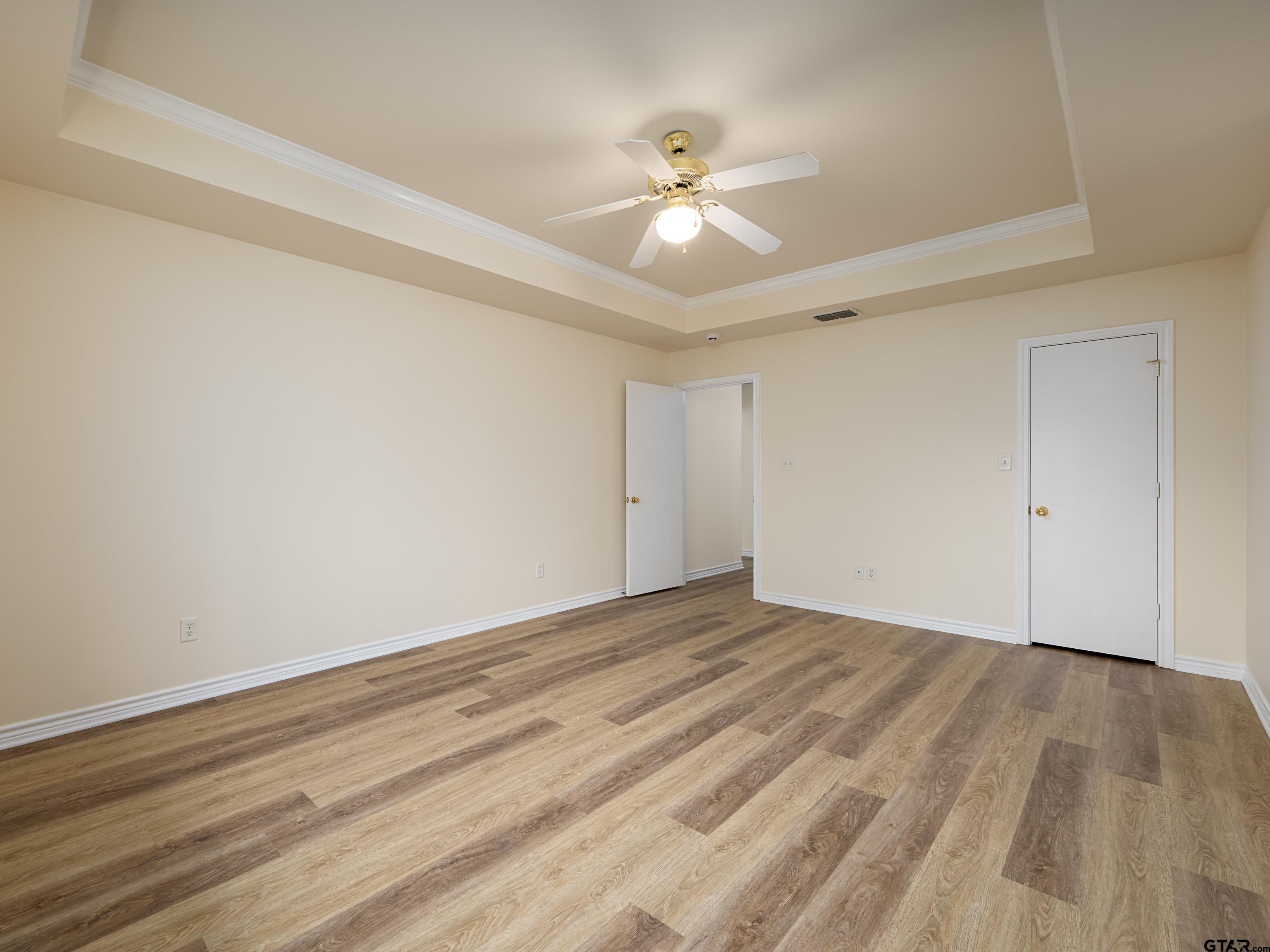 1521 Rice Road Tyler, TX 75703 - Photo 14 of 27 a view of an empty room with wooden floor