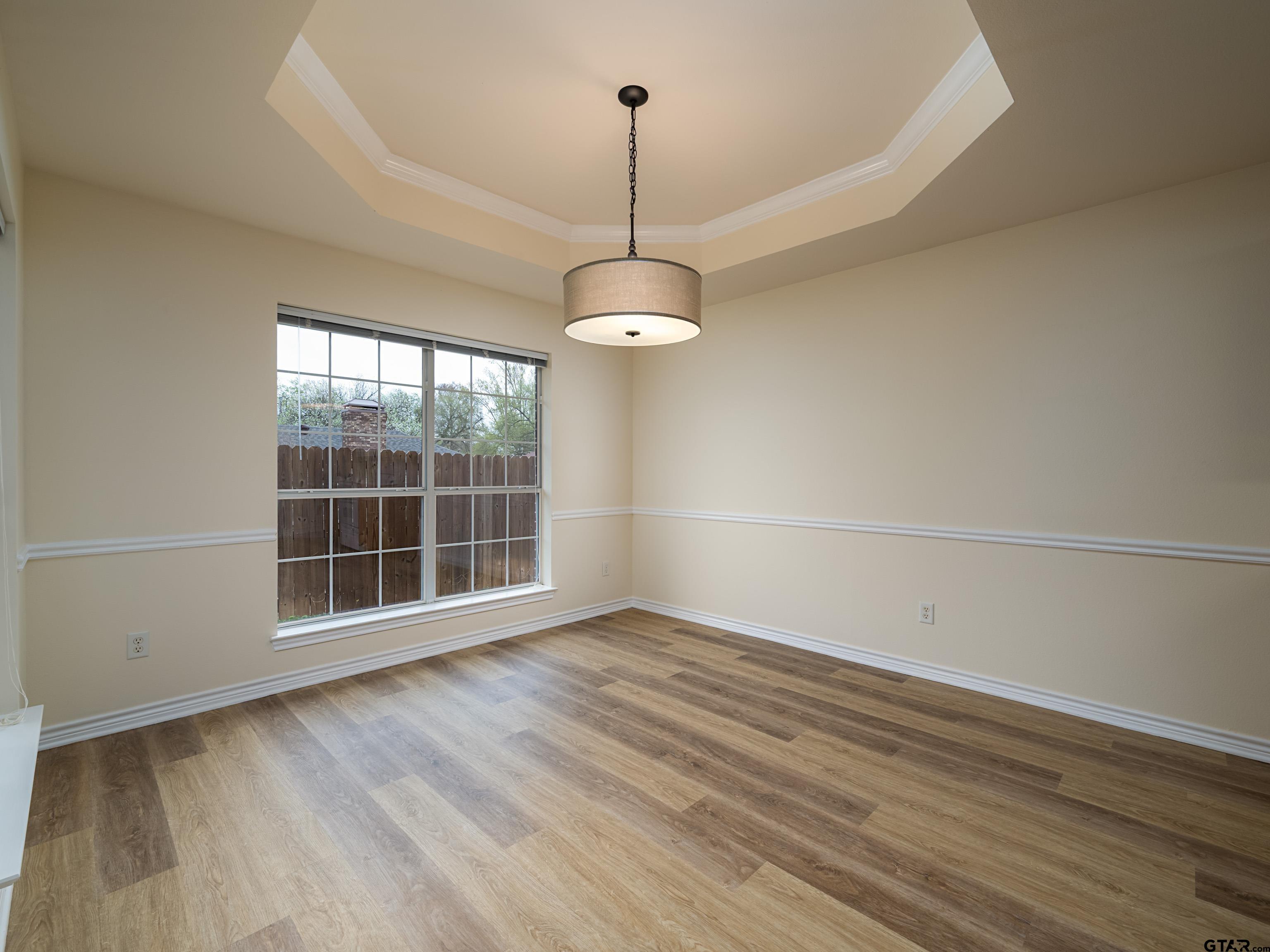 1521 Rice Road Tyler, TX 75703 - Photo 7 of 27 a view of a room with wooden floor and window