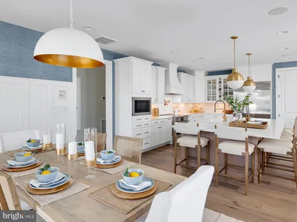 a dining room with dining table and wooden floor