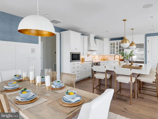 a dining room with dining table and wooden floor