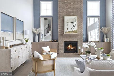 a living room with furniture fireplace and window