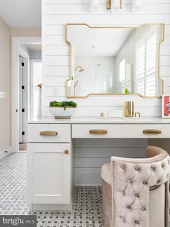 a kitchen with a sink a stove cabinets and a window