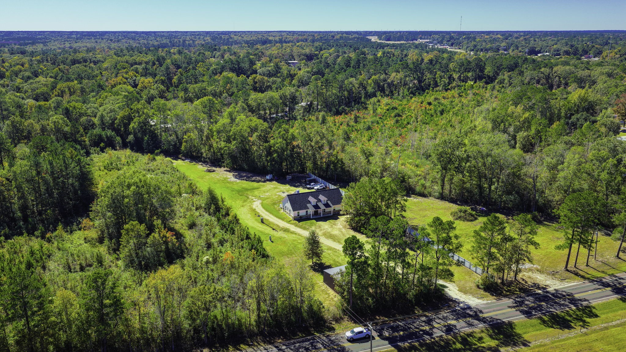 Luxury Meets Country Charm--Discover your dream retreat! Breathtaking custom-built estate on 2 picturesque unrestricted acres that perfectly blends modern luxury with peaceful country living. Designer 5BR, 2.5BA masterpiece w/ high-end finishes, soaring 10' ceilings & an open-concept ideal for entertaining.