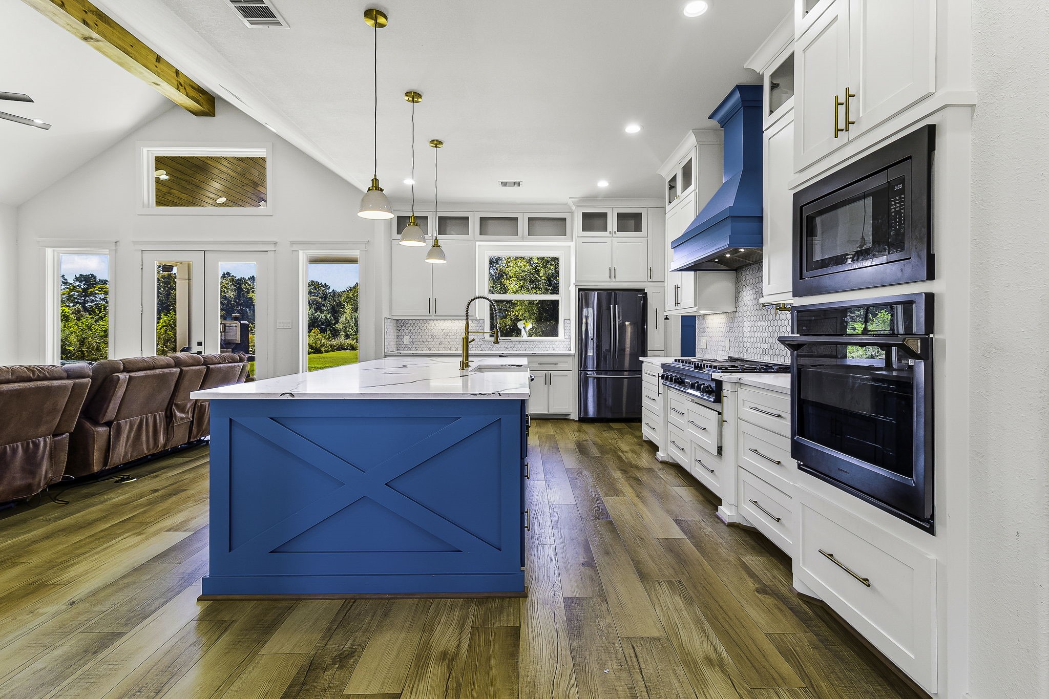 440 Farm To Market 223 Shepherd, TX 77371 - Photo 15 of 49 a kitchen with stainless steel appliances granite countertop a stove and a wooden floors