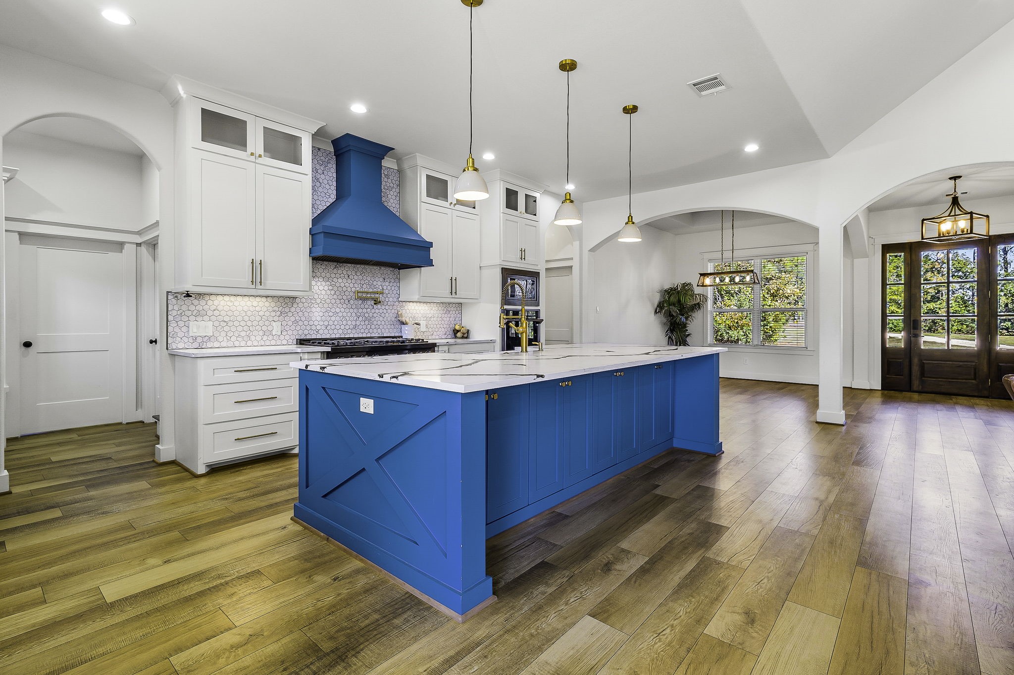 440 Farm To Market 223 Shepherd, TX 77371 - Photo 17 of 49 a kitchen with stainless steel appliances granite countertop a sink a stove and a wooden floors