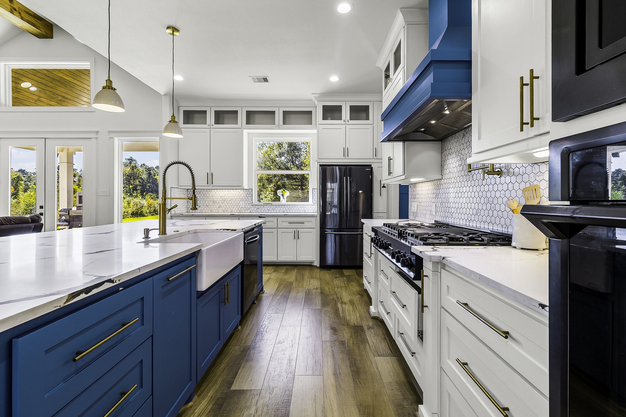 440 Farm To Market 223 Shepherd, TX 77371 - Photo 18 of 49 a large kitchen with stainless steel appliances granite countertop a stove a sink dishwasher and a refrigerator