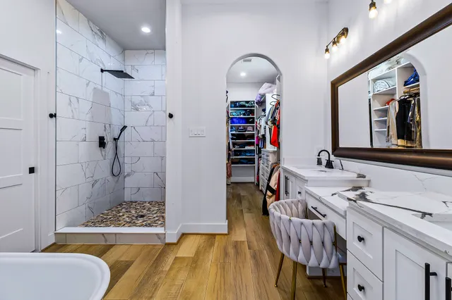 a bathroom with a sink and a chandelier