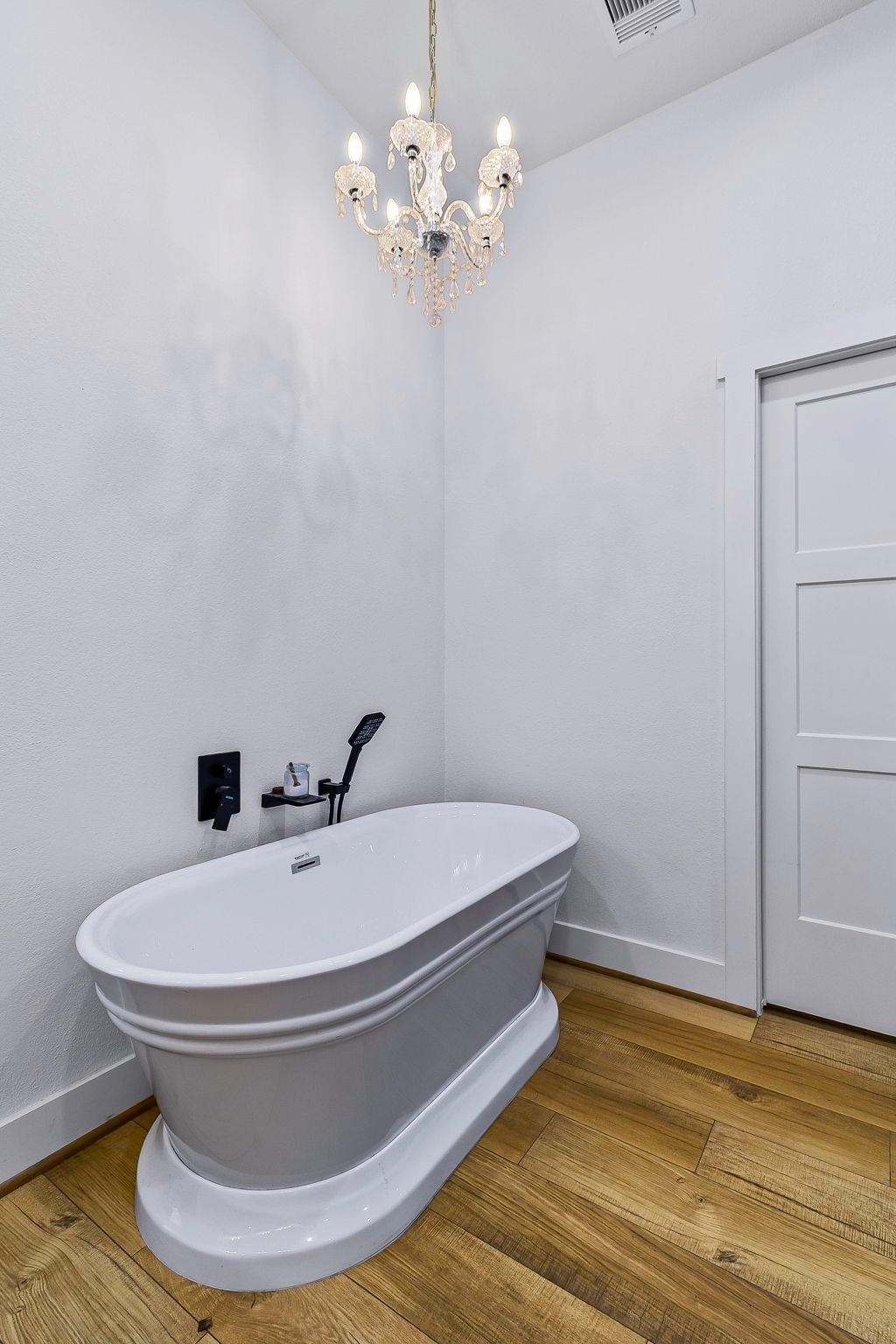 440 Farm To Market 223 Shepherd, TX 77371 - Photo 25 of 49 a bathroom with a sink and a chandelier