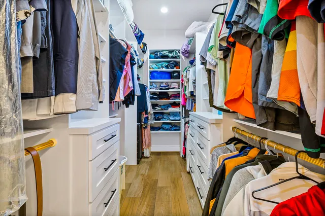 a bedroom with a bed and a table in it