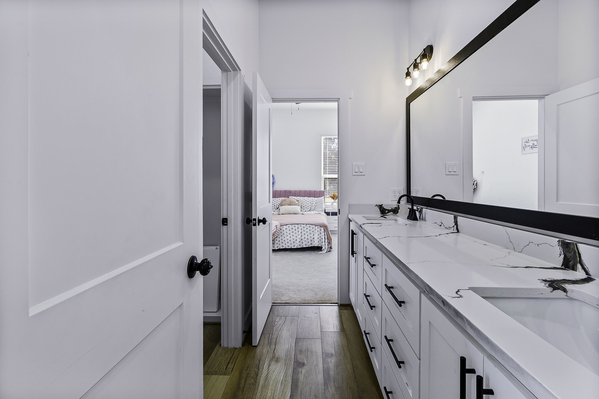 440 Farm To Market 223 Shepherd, TX 77371 - Photo 32 of 49 a bathroom with a double vanity sink and mirror