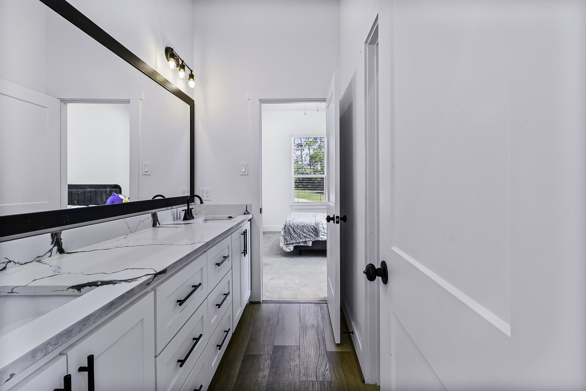 440 Farm To Market 223 Shepherd, TX 77371 - Photo 33 of 49 a en suite bathroom with a granite countertop sink and a mirror