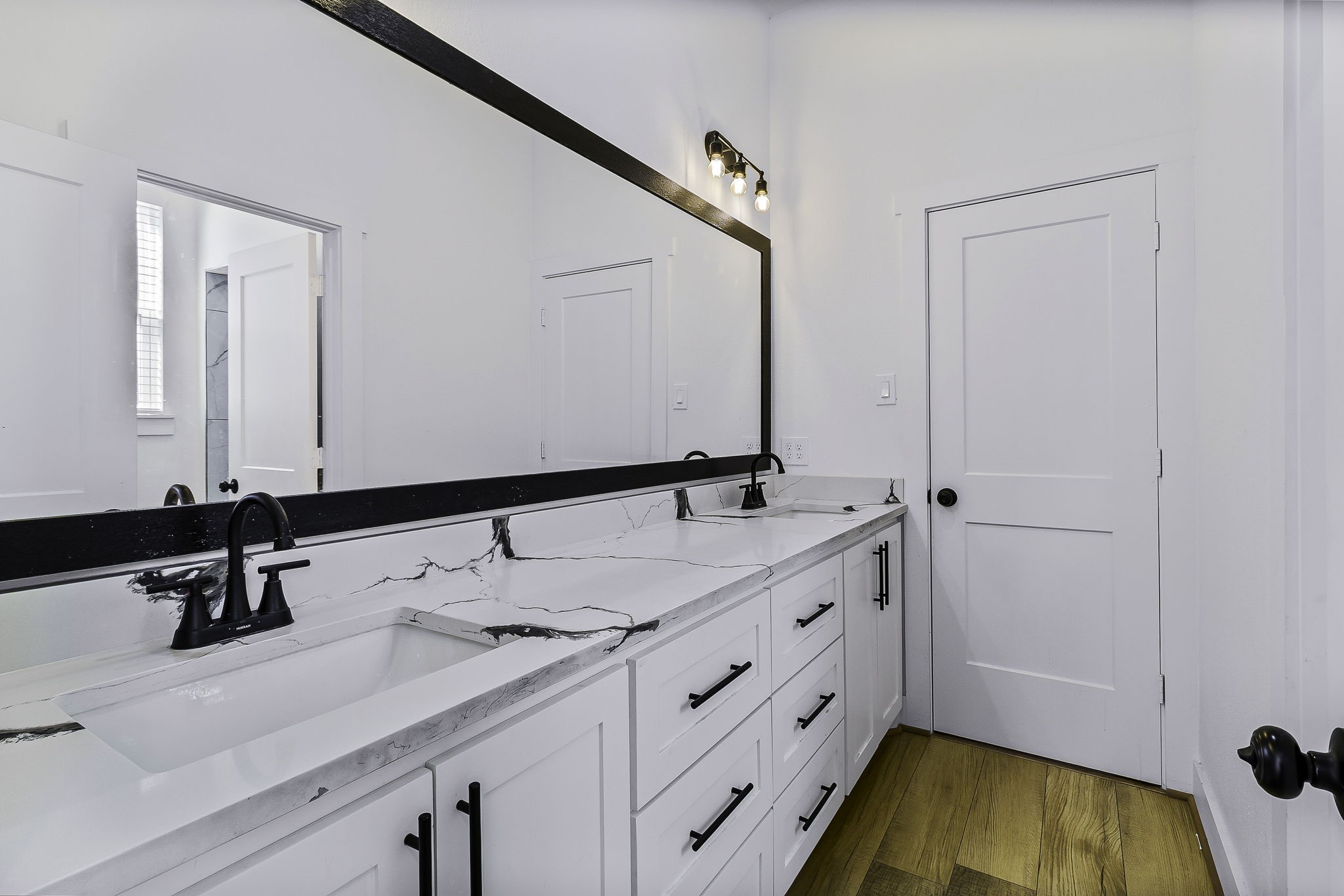 440 Farm To Market 223 Shepherd, TX 77371 - Photo 34 of 49 a bathroom with a double vanity sink and mirror