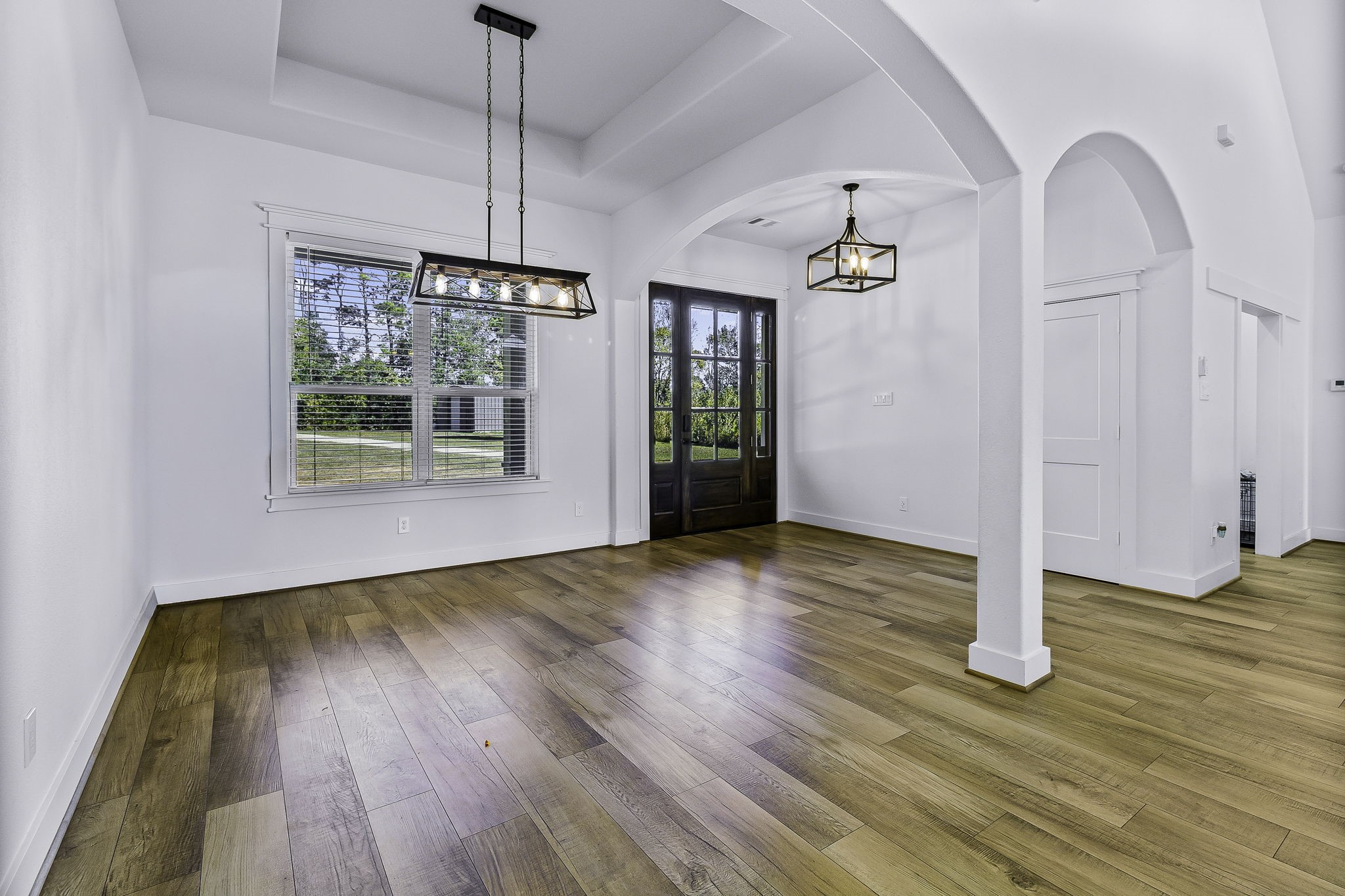 440 Farm To Market 223 Shepherd, TX 77371 - Photo 6 of 49 a view of an empty room with wooden floor and a window