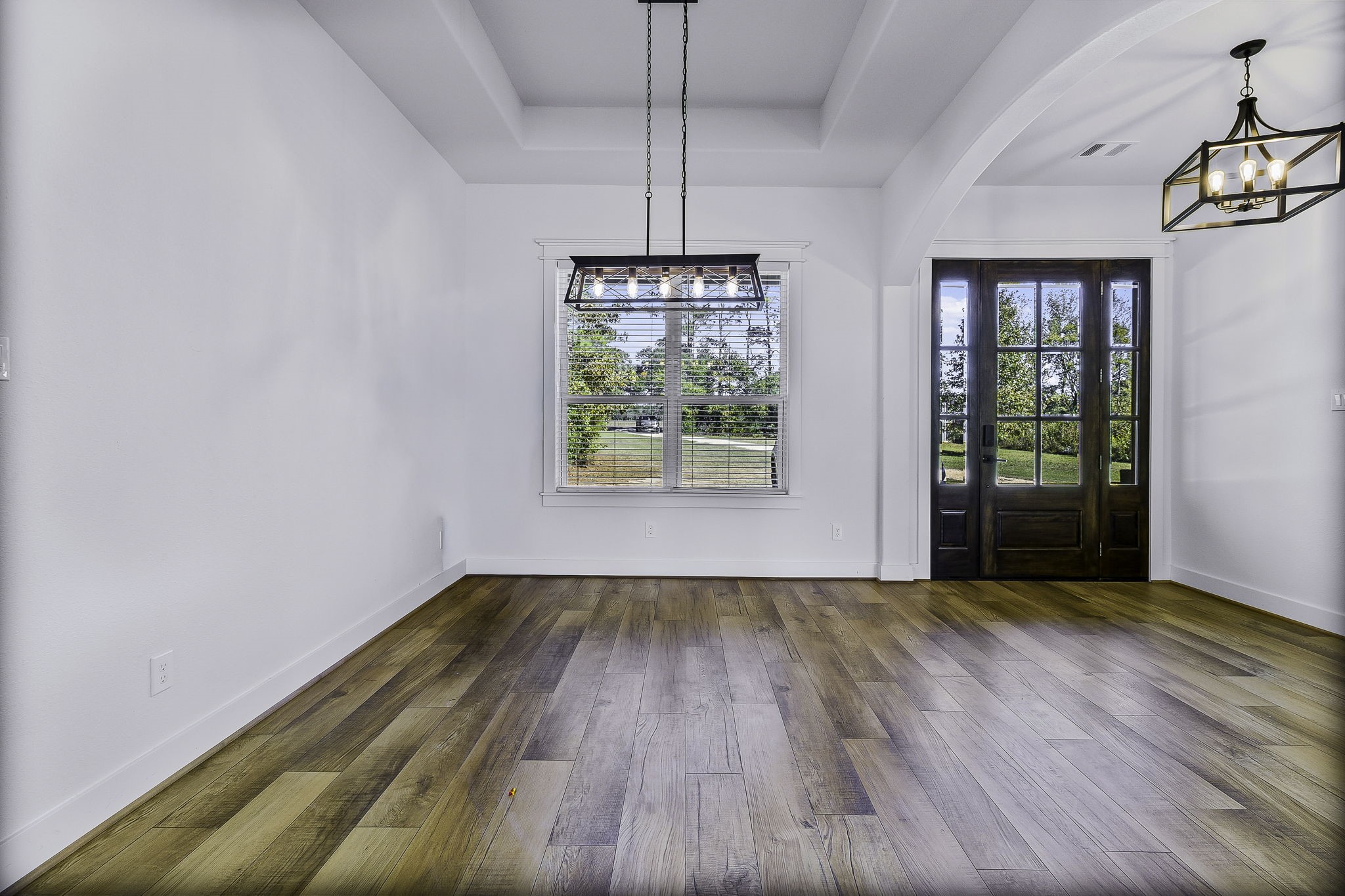 440 Farm To Market 223 Shepherd, TX 77371 - Photo 7 of 49 a view of an empty room with wooden floor and a window