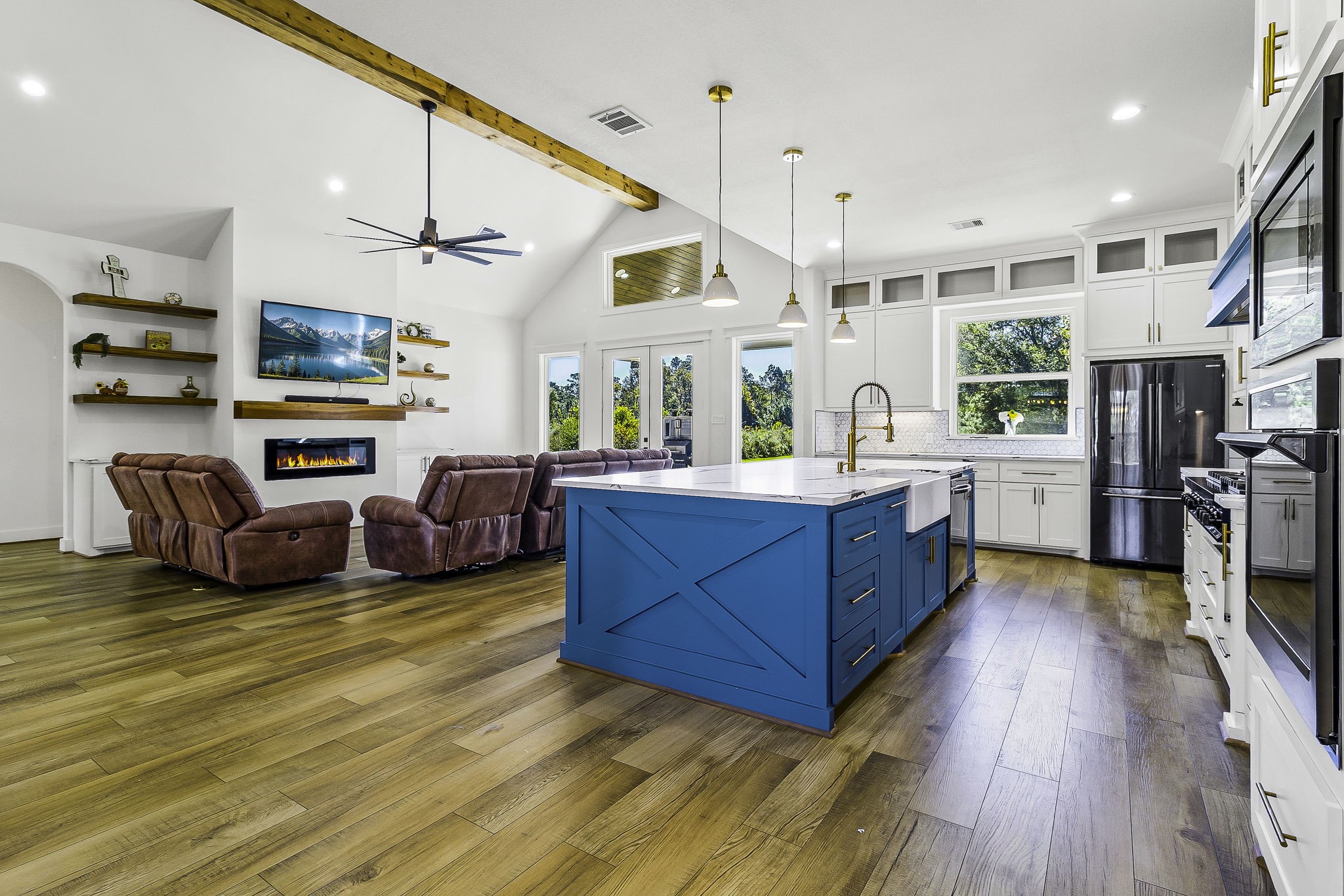 440 Farm To Market 223 Shepherd, TX 77371 - Photo 10 of 49 a large living room with stainless steel appliances granite countertop furniture a fireplace and a flat screen tv