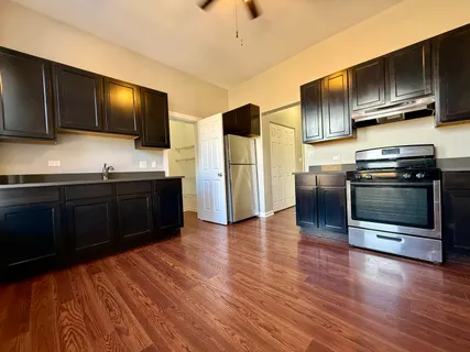 a kitchen with stainless steel appliances wooden cabinets and granite counter tops