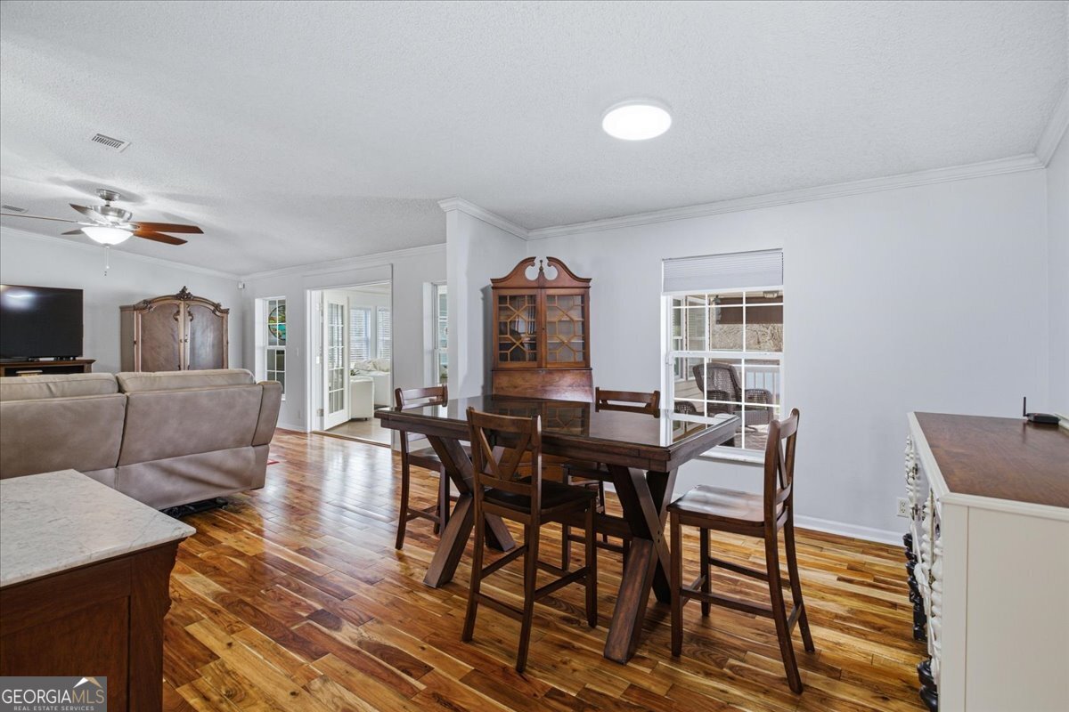 266 Payton Road Griffin, GA 30223 - Photo 14 of 48 a view of a dining room with furniture and wooden floor