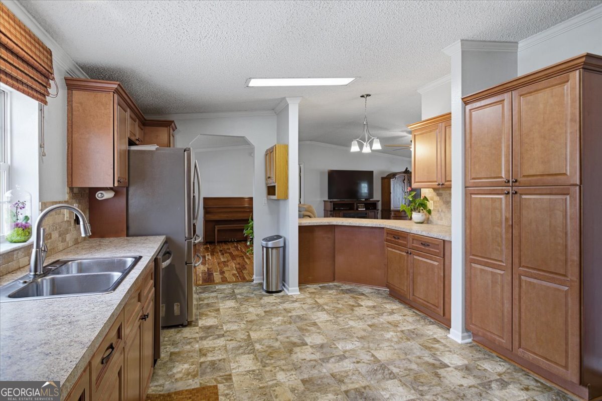 266 Payton Road Griffin, GA 30223 - Photo 15 of 48 a kitchen with refrigerator cabinets and a sink