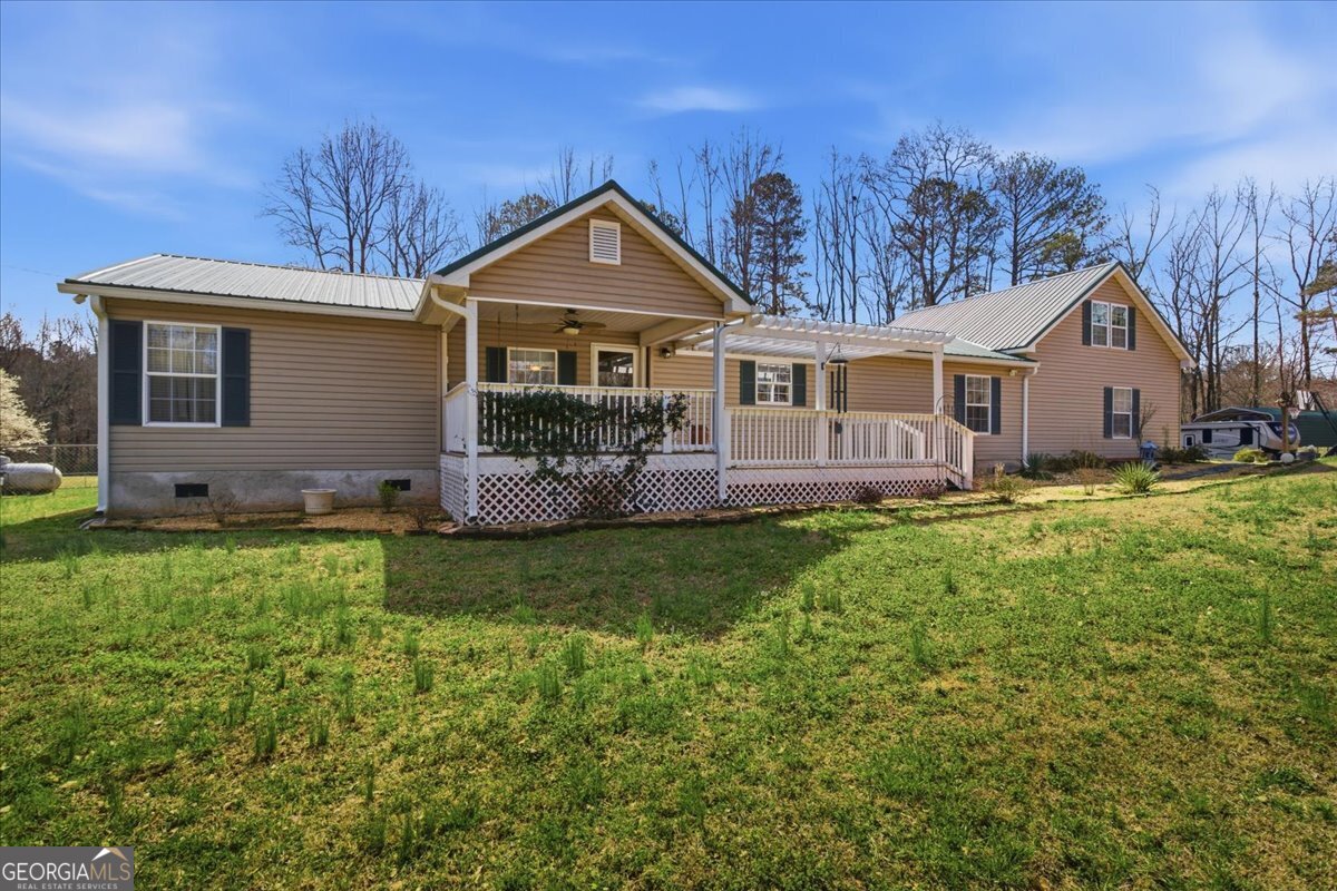 266 Payton Road Griffin, GA 30223 - Photo 2 of 48 a front view of a house with a yard