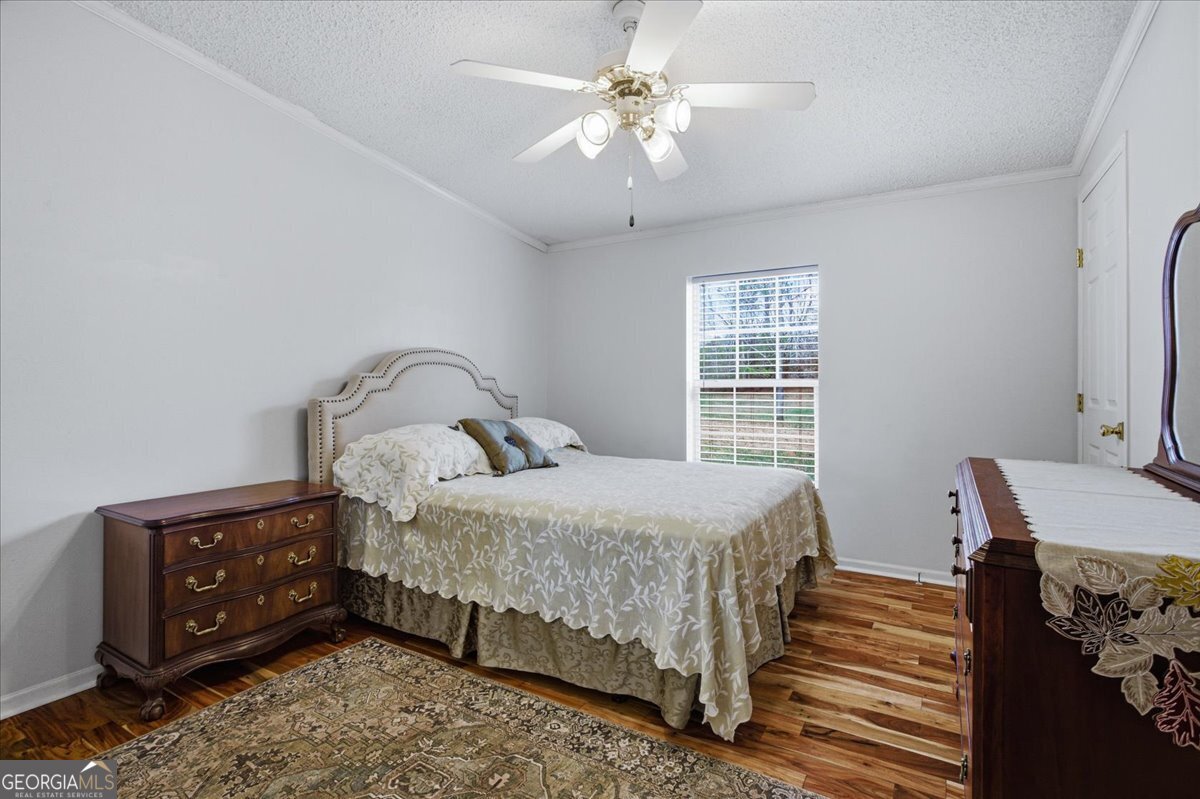 266 Payton Road Griffin, GA 30223 - Photo 21 of 48 a bedroom with a bed and a chandelier