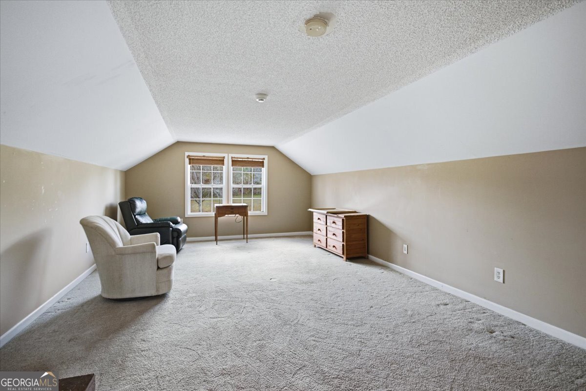 266 Payton Road Griffin, GA 30223 - Photo 25 of 48 a living room with furniture and window