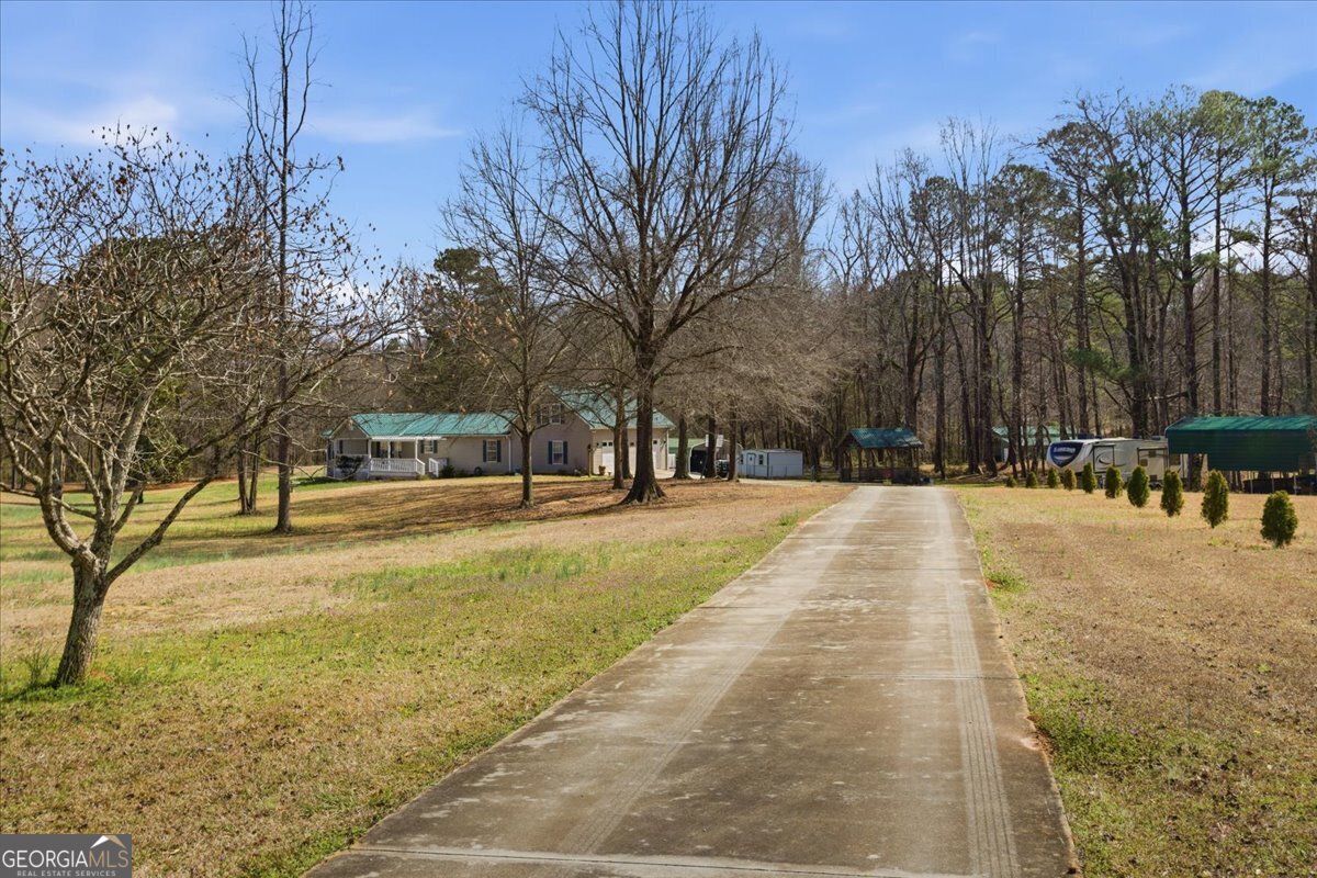266 Payton Road Griffin, GA 30223 - Photo 26 of 48 a view of road with trees