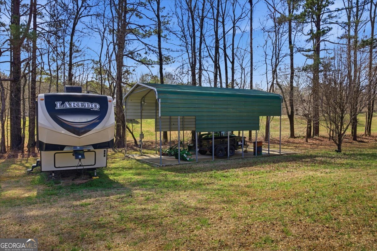 266 Payton Road Griffin, GA 30223 - Photo 27 of 48 a view of a chairs in a backyard