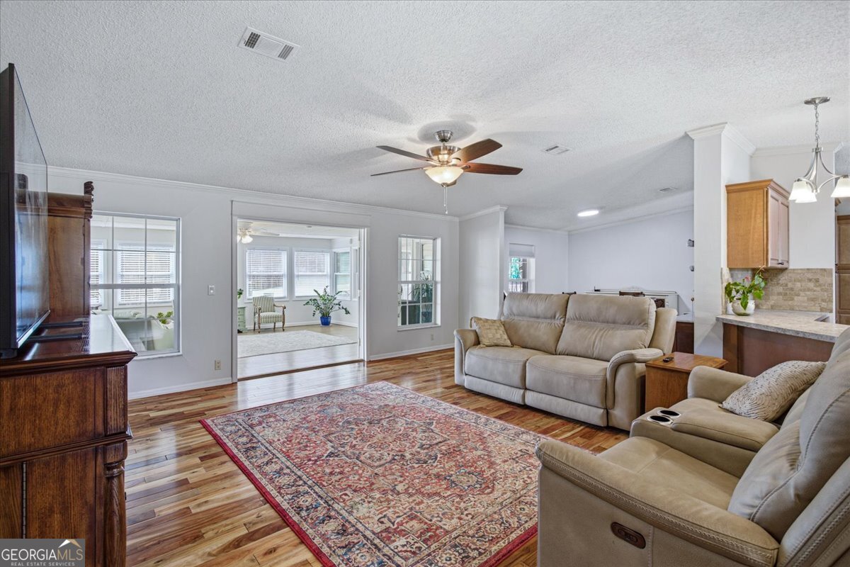 266 Payton Road Griffin, GA 30223 - Photo 4 of 48 a living room with furniture and a flat screen tv