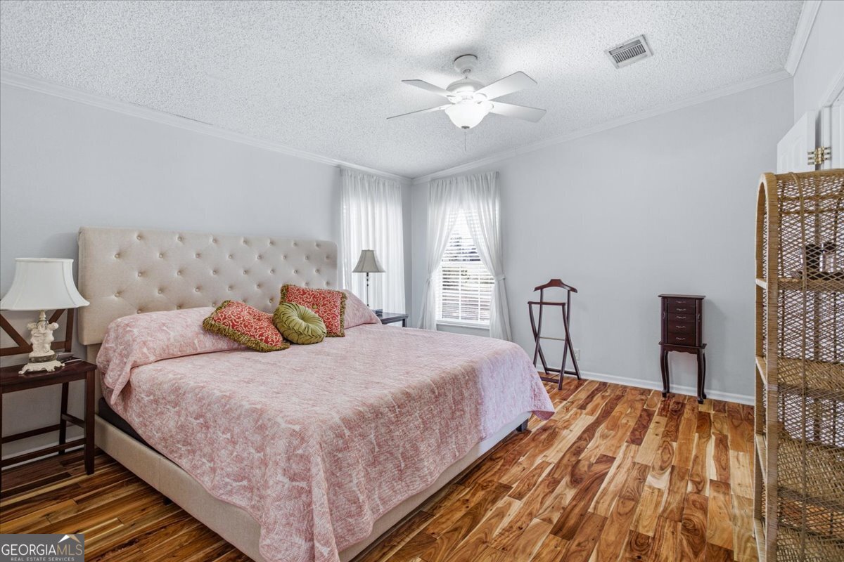 266 Payton Road Griffin, GA 30223 - Photo 7 of 48 a bedroom with a bed and a chandelier