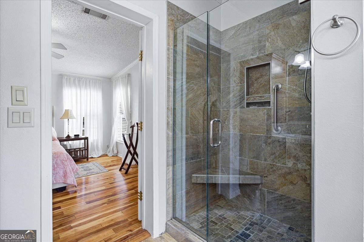 266 Payton Road Griffin, GA 30223 - Photo 8 of 48 a bathroom with a glass shower door