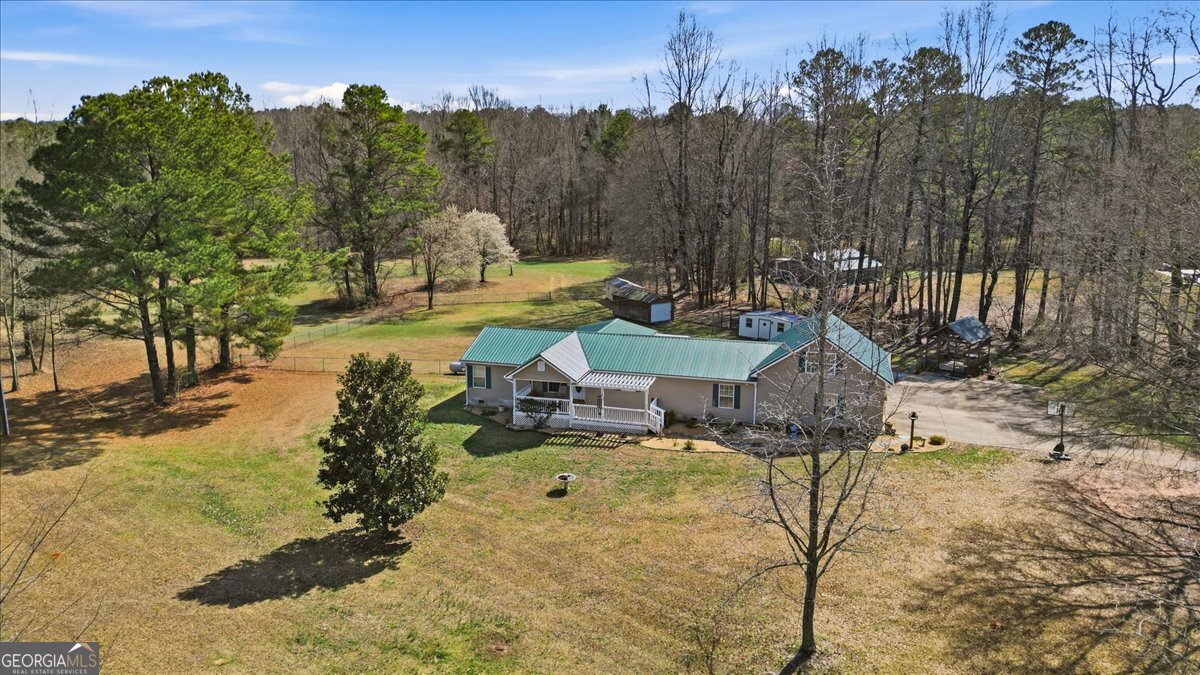 266 Payton Road Griffin, GA 30223 - Photo 9 of 48 a view of a swimming pool with a patio
