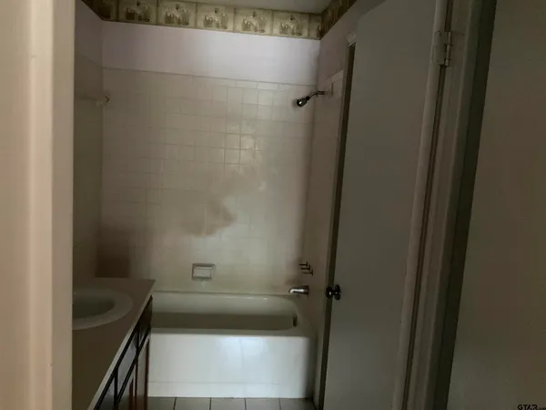 a bathroom with a sink and a bathtub