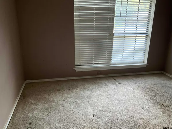 a view of a room that has a window in it