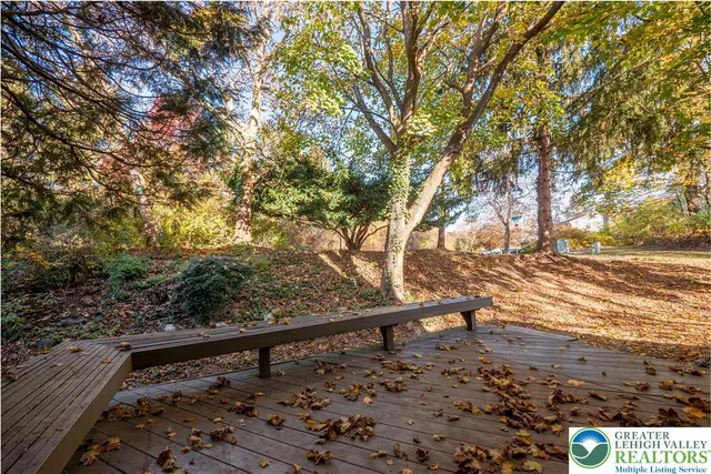 a view of swimming pool with a table and chairs