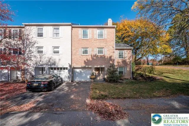 a view of multiple house with a yard