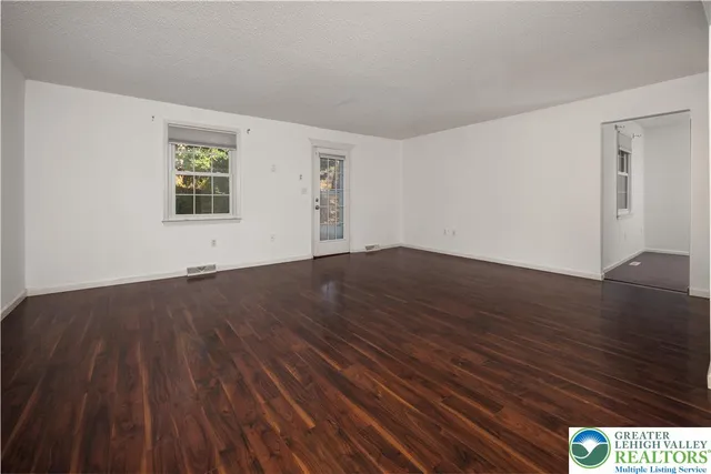 a kitchen with a sink stove and microwave