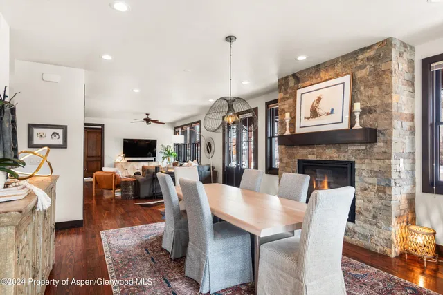 a view of hall way with mirror and furniture