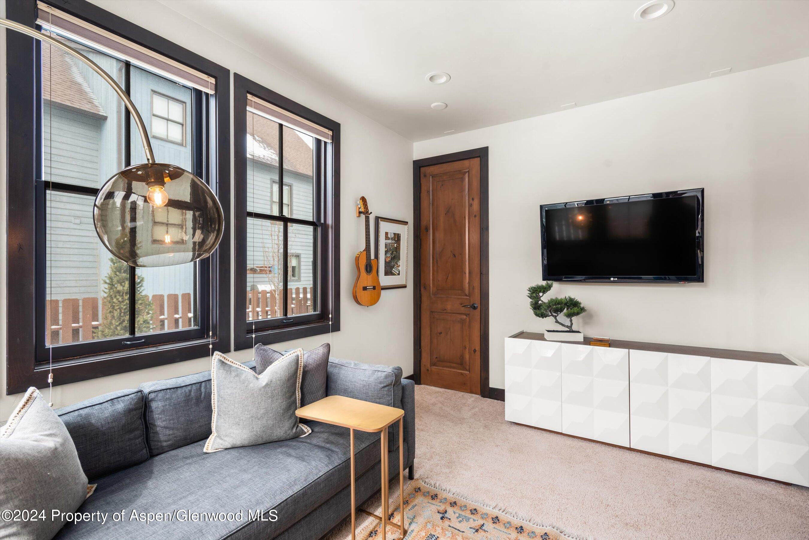333 Sopris Circle Basalt, CO 81621 - Photo 21 of 57 a living room with furniture and a flat screen tv