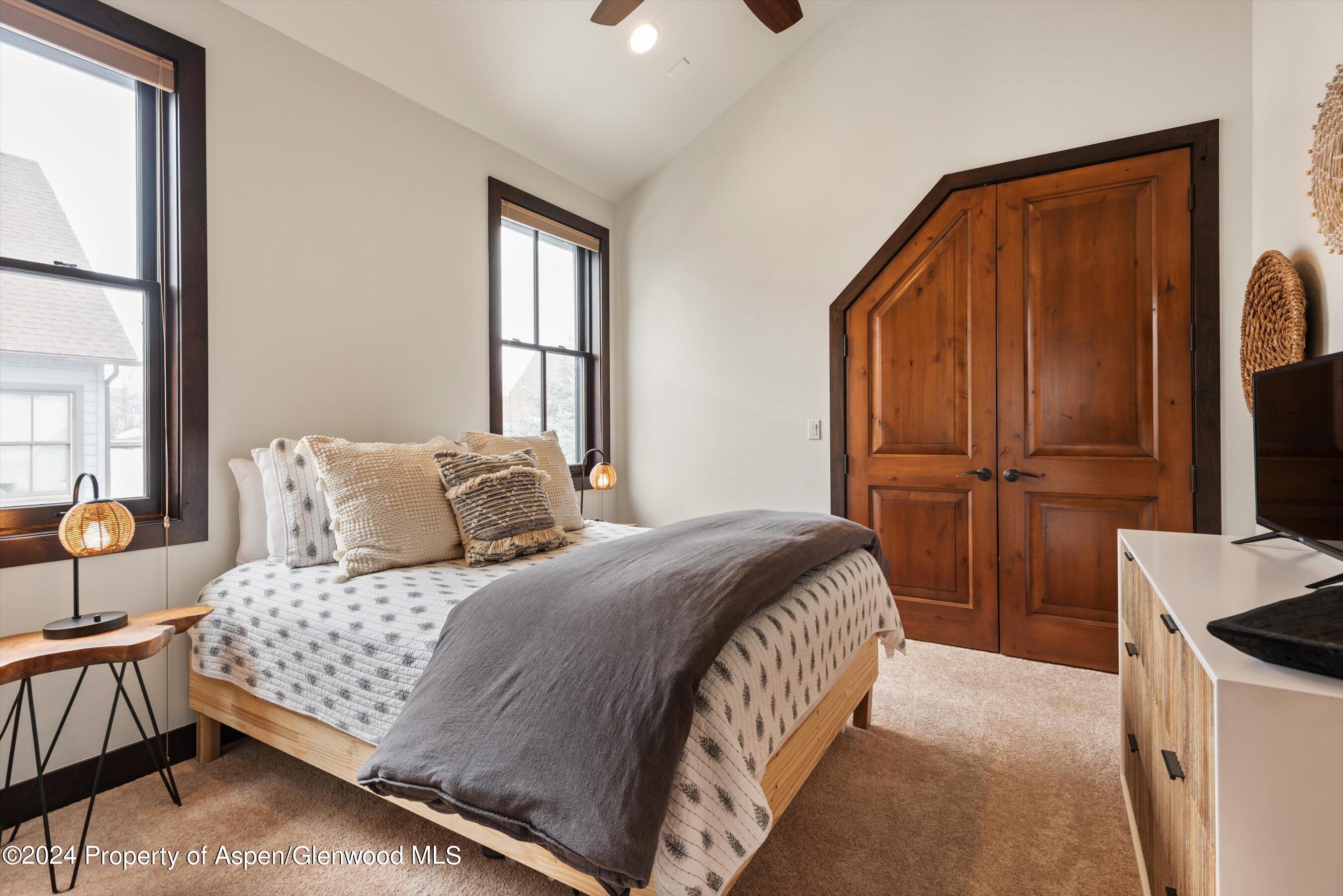 333 Sopris Circle Basalt, CO 81621 - Photo 34 of 57 a bedroom with a bed and a dresser with mirror