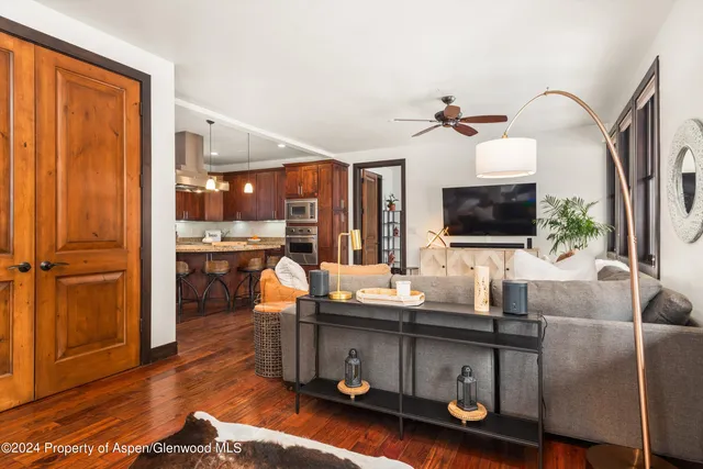 a living room with furniture and a flat screen tv