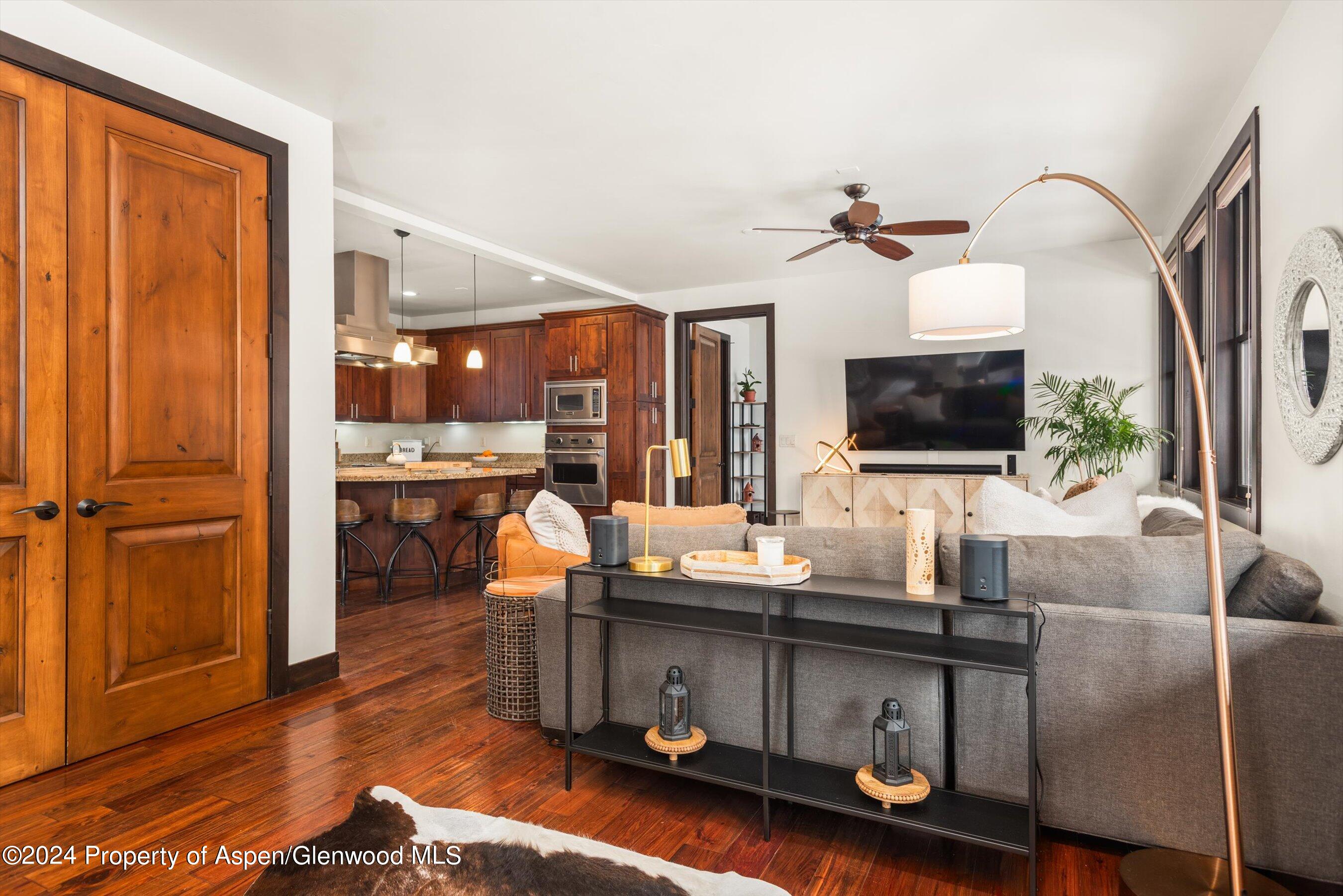 333 Sopris Circle Basalt, CO 81621 - Photo 4 of 57 a living room with furniture and a flat screen tv