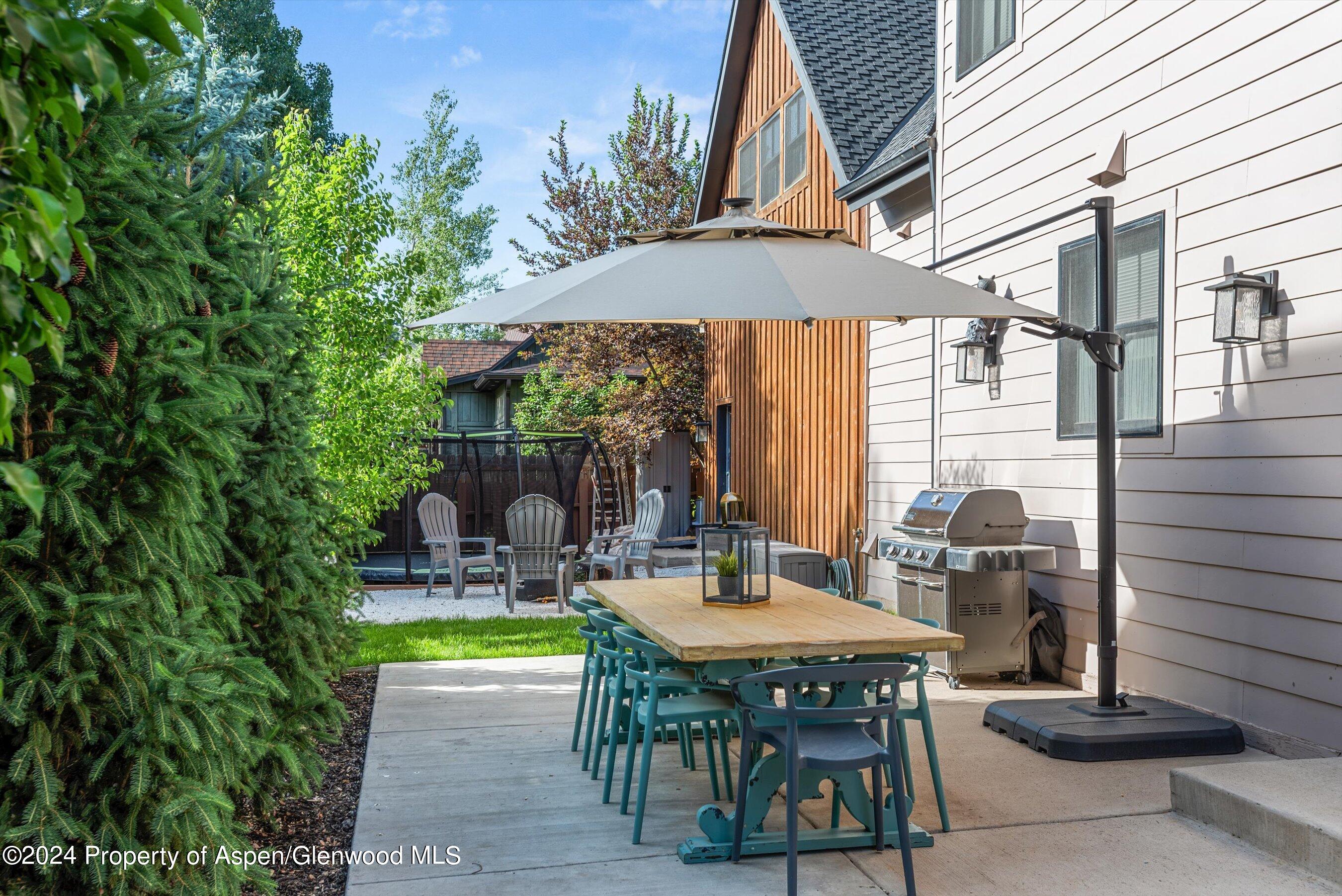 333 Sopris Circle Basalt, CO 81621 - Photo 47 of 57 a backyard of a house with table and chairs