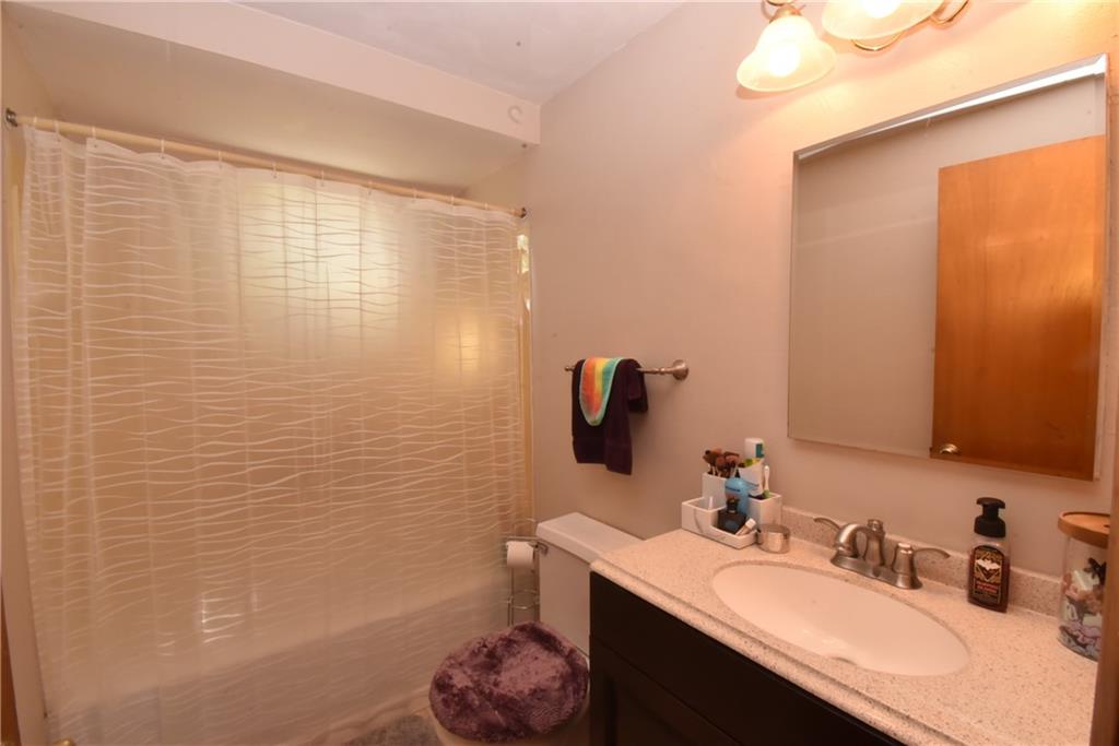 503 McKee Road Washington, PA 15301 - Photo 17 of 24 a bathroom with a sink a toilet and a mirror