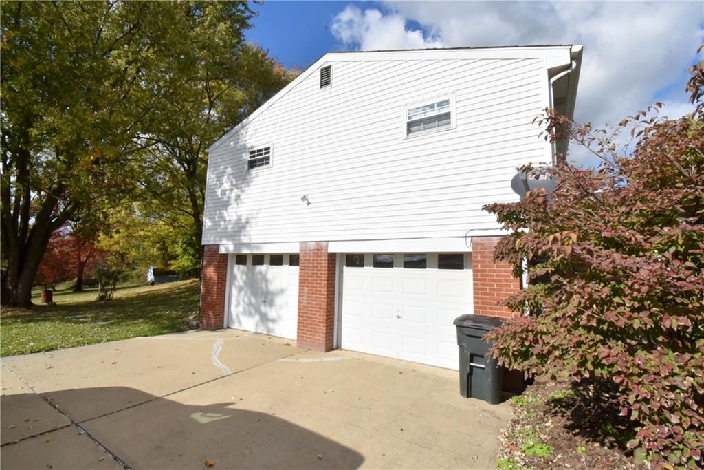 503 McKee Road Washington, PA 15301 - Photo 21 of 24 a view of a white house with a yard and garage