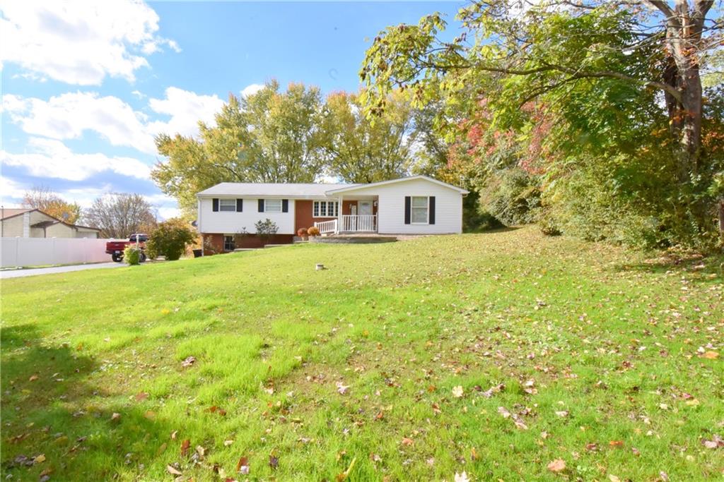 503 McKee Road Washington, PA 15301 - Photo 3 of 24 a view of a house with a big yard and large trees