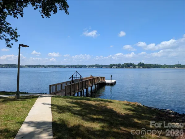 a view of a lake with houses in the background