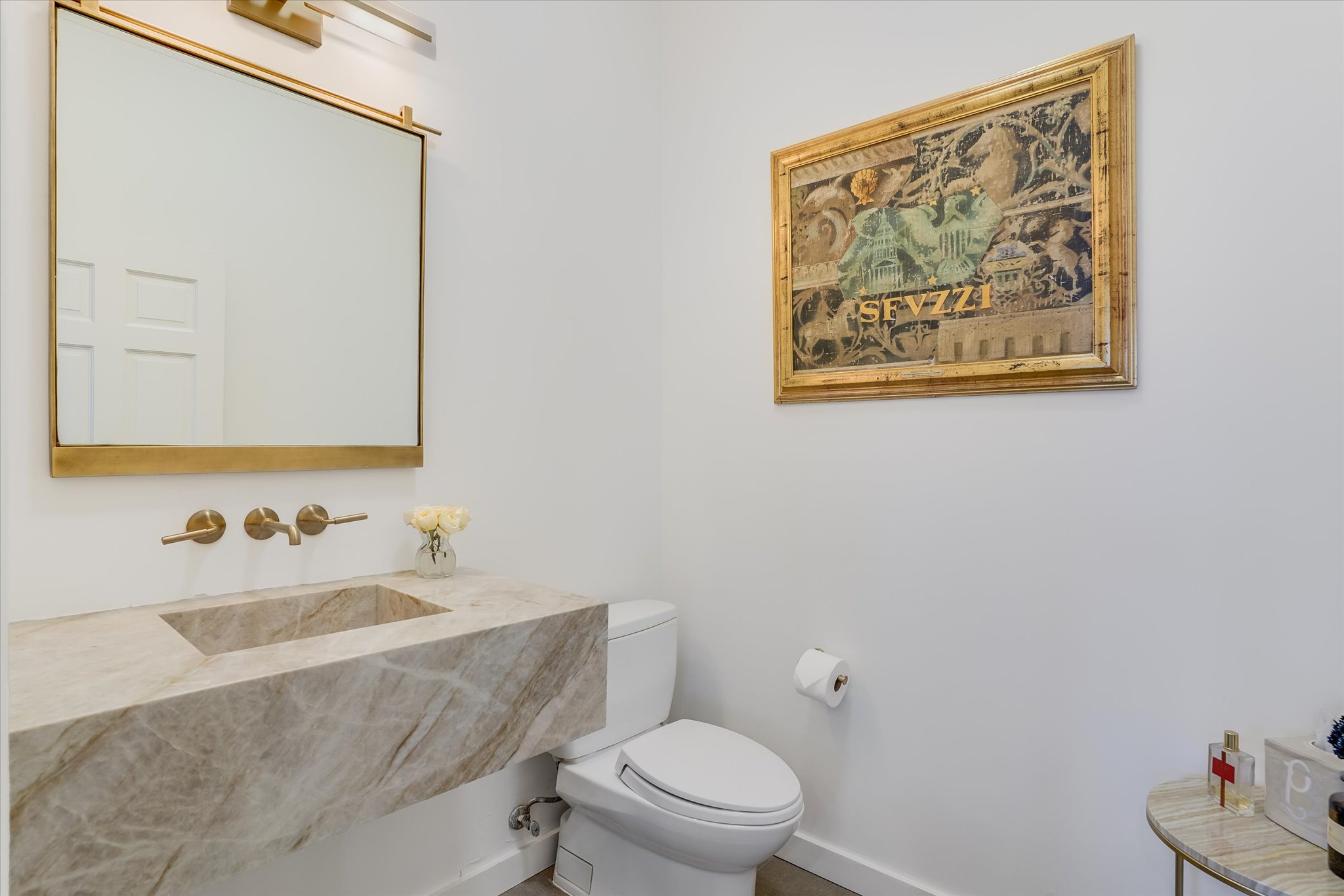 3705 Gilbert Street, Unit B Austin, TX 78703 - Photo 11 of 35 Half bathroom with a sink and toilet