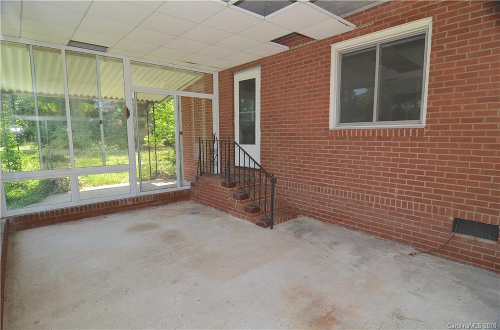 6207 Tuckaseegee Road Charlotte, NC 28208 - Photo 12 of 20 a view of an empty room with windows